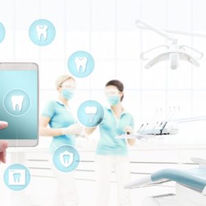 dentist hand touch smart phone screen, teeth icons and symbols on dental clinic with dentist's chair background web banner template